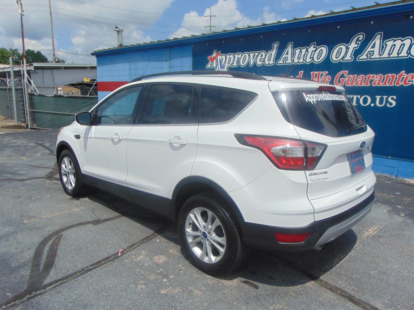 2017 White Ford Escape (1FMCU9GD4HU) with an 4-Cyl EcoBoost 1.5T engine, Auto, 6-Spd w/SelShft transmission, located at 2105 Dixie Hwy, Louisville, KY, 40210, (502) 772-3333, 38.220932, -85.795441 - We're Kentuckiana's Number 1 Buy Here Pay Here and 2nd chance finance dealership! Conveniently located in central Louisville, Kentucky and right across the Ohio river from Southern Indiana we strive to provide clean dependable used cars, trucks, vans and SUV’s with affordable down payments and pay - Photo#24