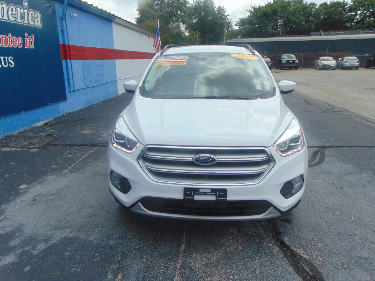 2017 White Ford Escape (1FMCU9GD4HU) with an 4-Cyl EcoBoost 1.5T engine, Auto, 6-Spd w/SelShft transmission, located at 2105 Dixie Hwy, Louisville, KY, 40210, (502) 772-3333, 38.220932, -85.795441 - We're Kentuckiana's Number 1 Buy Here Pay Here and 2nd chance finance dealership! Conveniently located in central Louisville, Kentucky and right across the Ohio river from Southern Indiana we strive to provide clean dependable used cars, trucks, vans and SUV’s with affordable down payments and pay - Photo#4