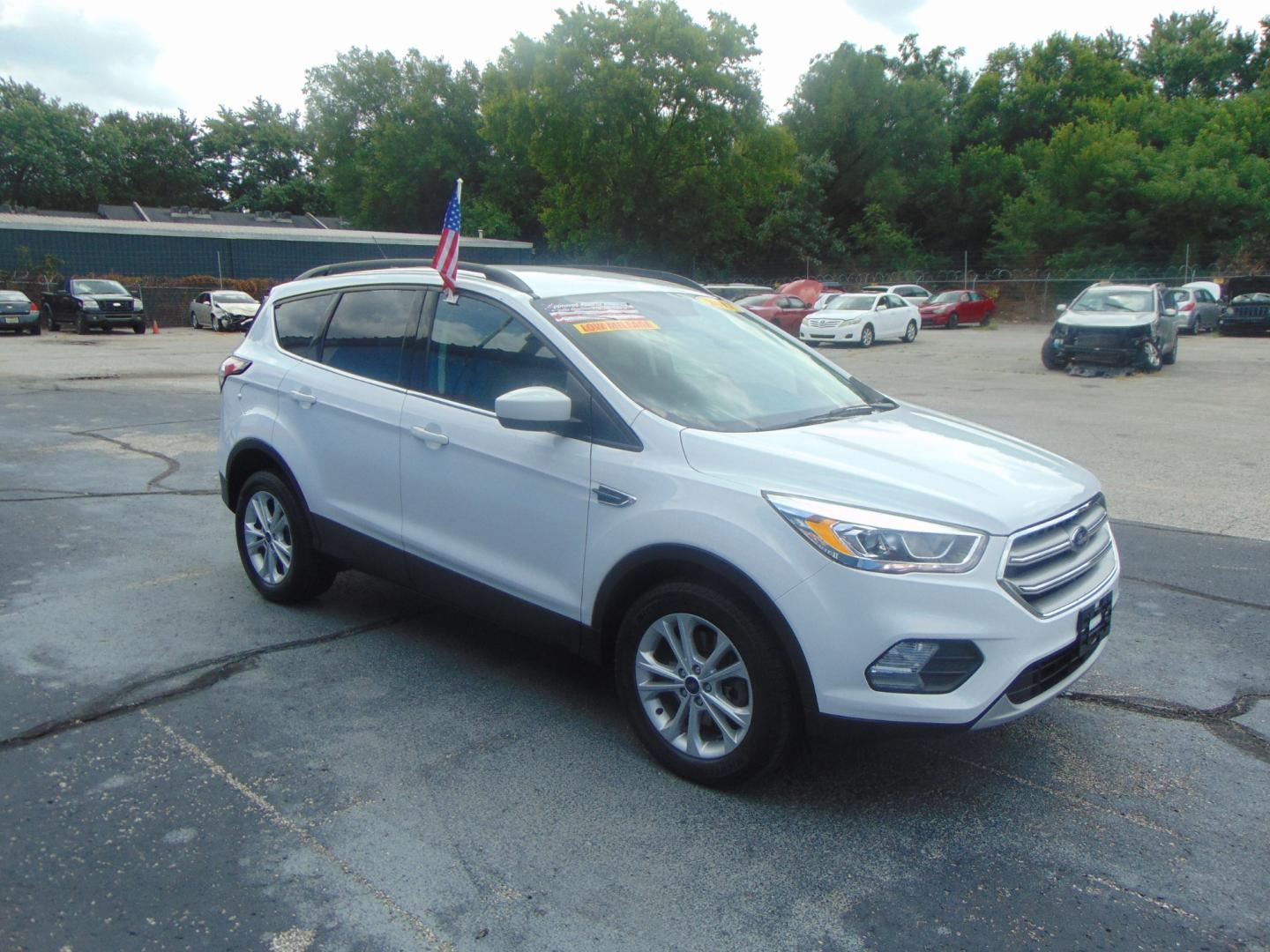 2017 White Ford Escape (1FMCU9GD4HU) with an 4-Cyl EcoBoost 1.5T engine, Auto, 6-Spd w/SelShft transmission, located at 2105 Dixie Hwy, Louisville, KY, 40210, (502) 772-3333, 38.220932, -85.795441 - We're Kentuckiana's Number 1 Buy Here Pay Here and 2nd chance finance dealership! Conveniently located in central Louisville, Kentucky and right across the Ohio river from Southern Indiana we strive to provide clean dependable used cars, trucks, vans and SUV’s with affordable down payments and pay - Photo#5